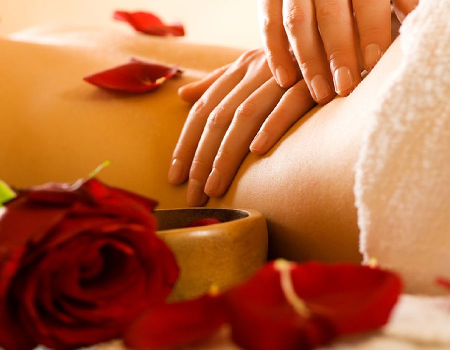 Aromatherapy massage with rose petals