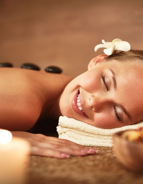 Hot stone massage by candlelight