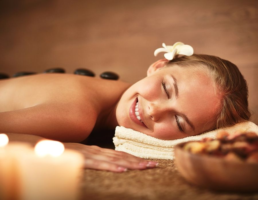 Hot stone massage by candlelight