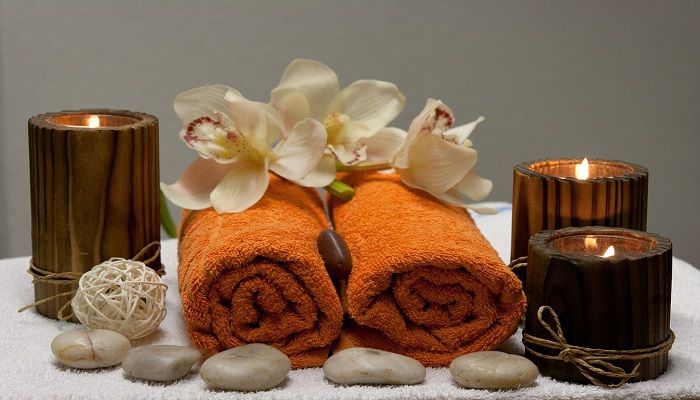 Spa towels, orchids and candles